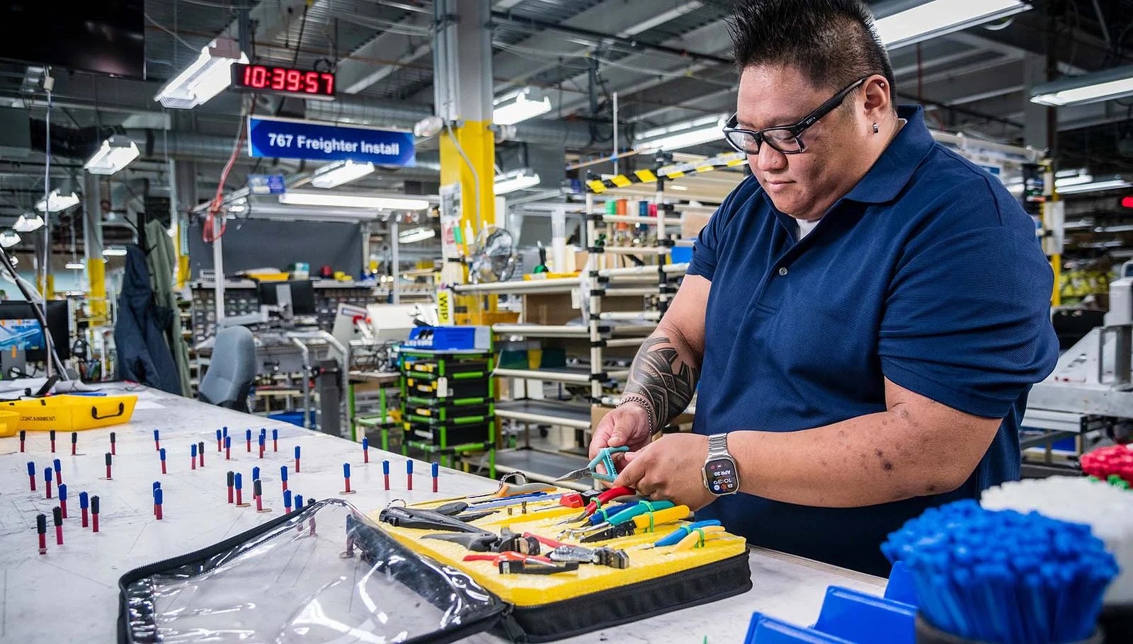 Derik Ibay applies 3D-printed bands to secure wire cutters and pliers when not in use.