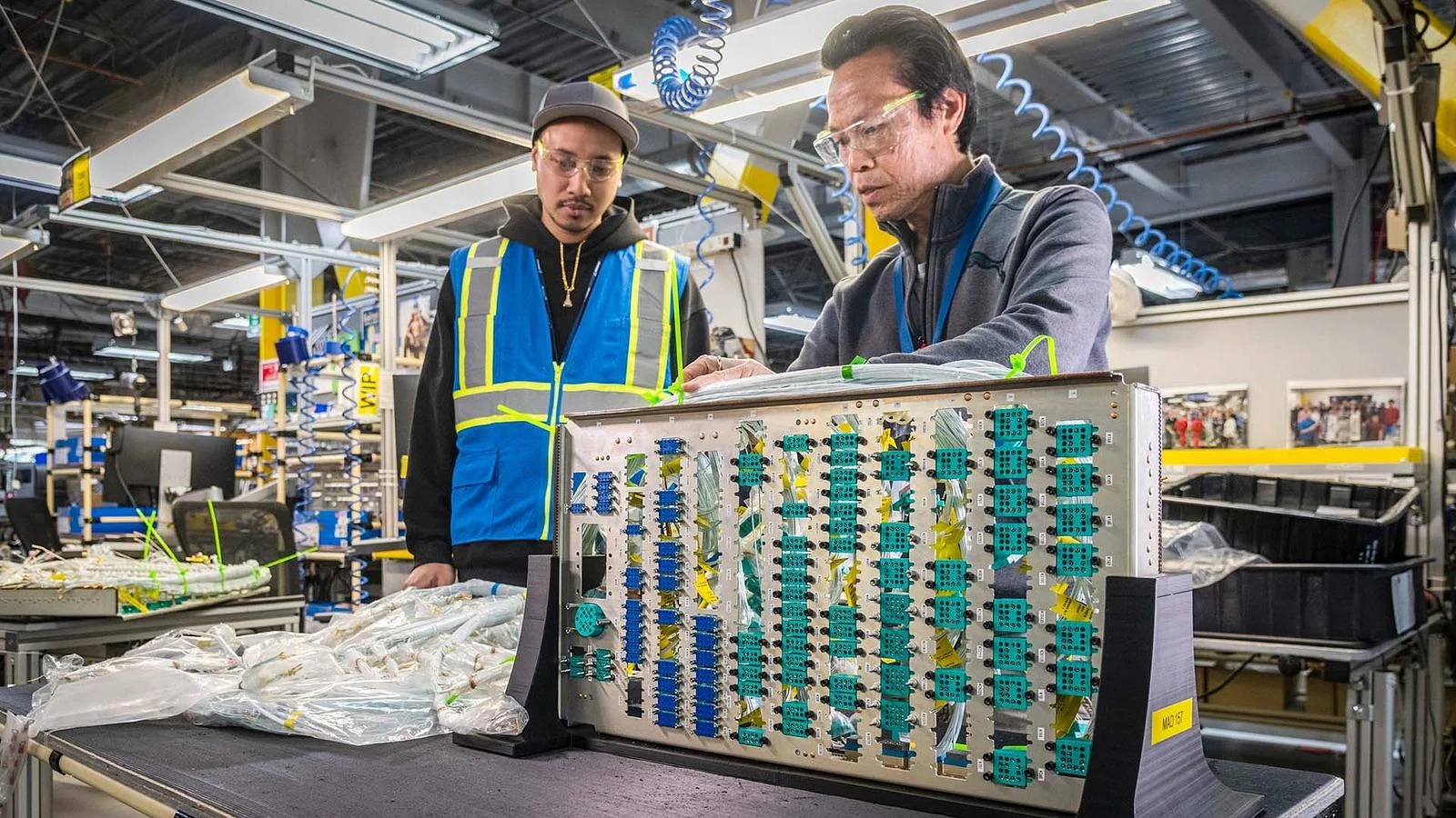 Patrick Chuoy (left) and Davoth Un test the new tray to ensure it remains stable during use. 