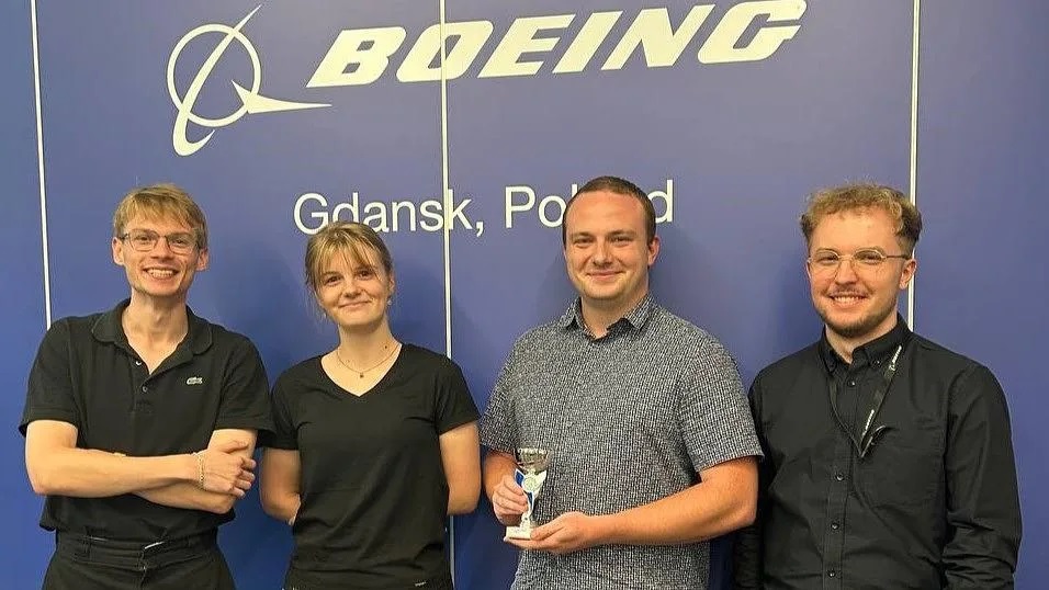 Boeing interns Michal Kisiolek, Maja Szymanska, Marek Lokaj and Oskar Grochowalski accept a group project award at Lean Fest 2025 in Gdańsk, Poland.