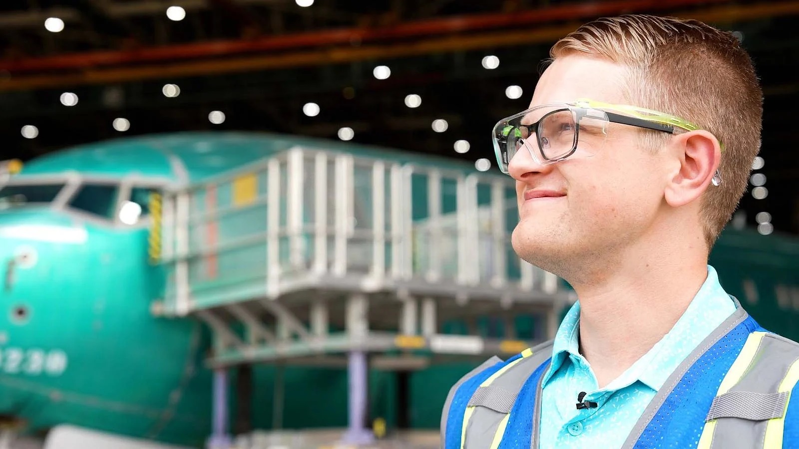 Engineer Aidan Sesnic gives a tour of the factory where he works on 737 flight decks. 