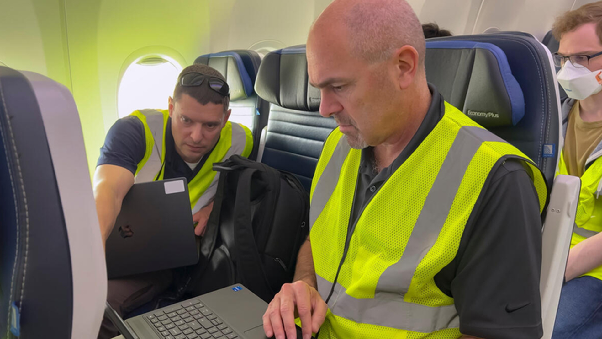 Greg Saccone (right front) participating in ground tests with software engineer Ryan Hale (left) and BCA cyber security engineer Brandon Nepute. (photo Paul Weatherman © Boeing)