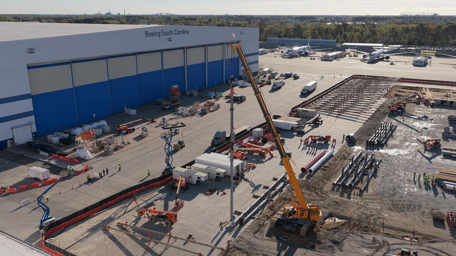 Teams set the first piece of steel for the new 88-48 building, marking a major milestone in the site expansion work happening at Boeing South Carolina.