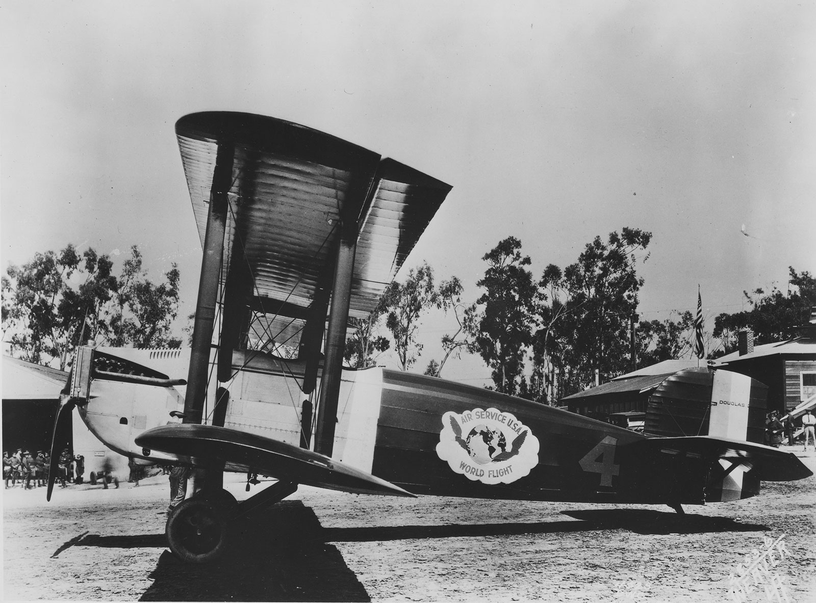 Black and white photo of a Douglas World Cruiser, a biplane, on the ground.