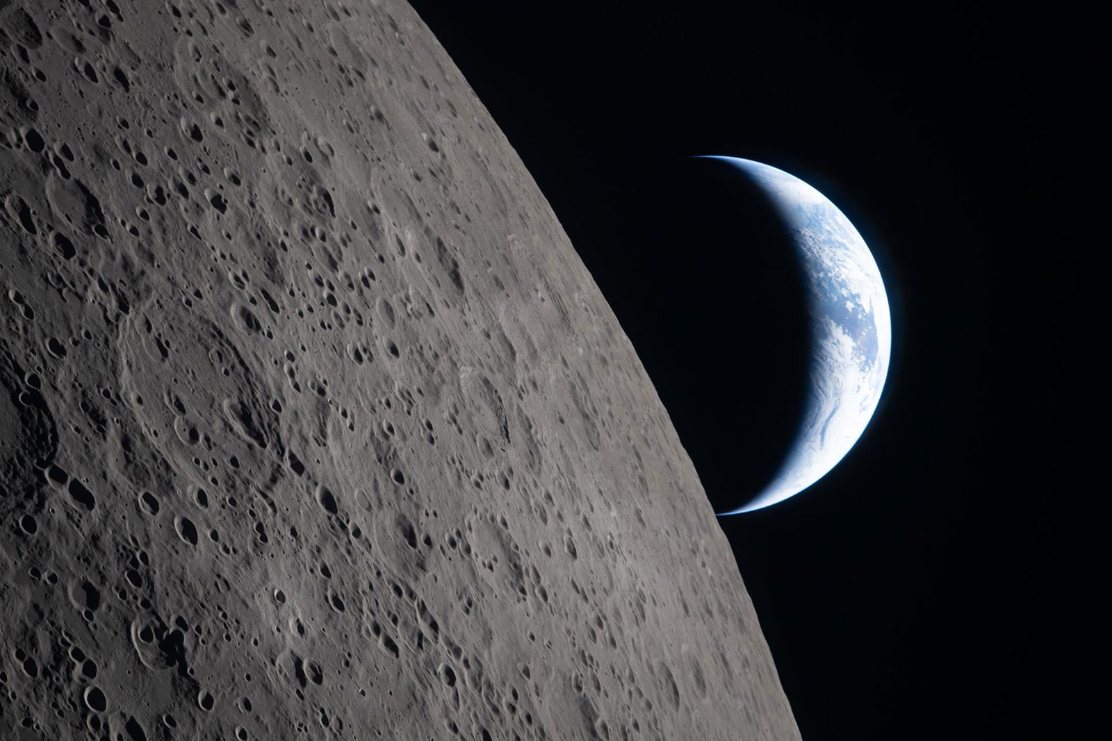The Artemis II crew captured this image of a crescent Earth setting on the edge of the visible surface of the moon, called the “lunar limb.”