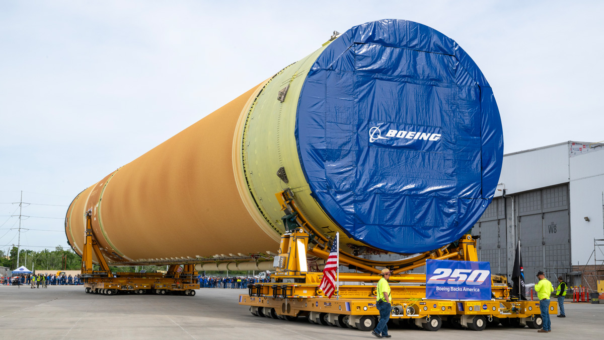 SLS core stage 3 top four-fifths reps Boeing blue on the way to NASA's Pegasus barge