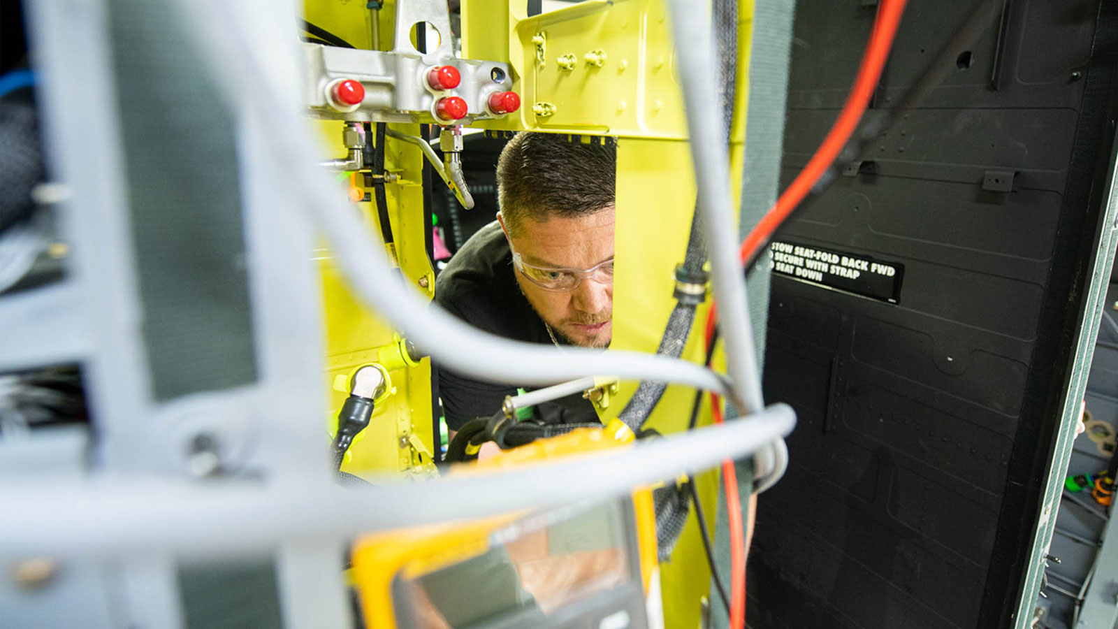 A Boeing Philadelphia teammate installs the first Active Parallel Actuator System on a Chinook aircraft.