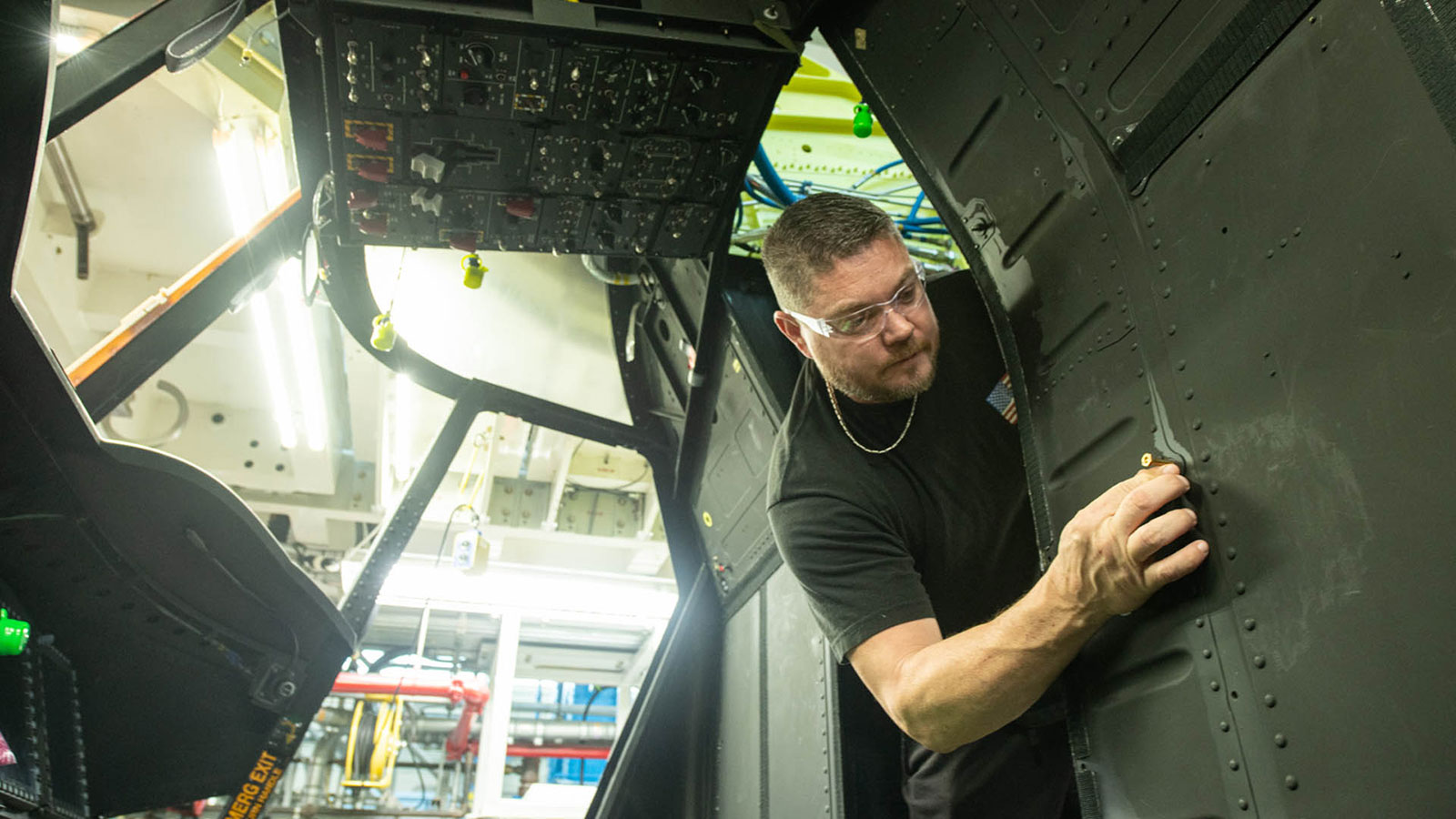 A Boeing Philadelphia teammate installs the first Active Parallel Actuator System on a Chinook aircraft.
