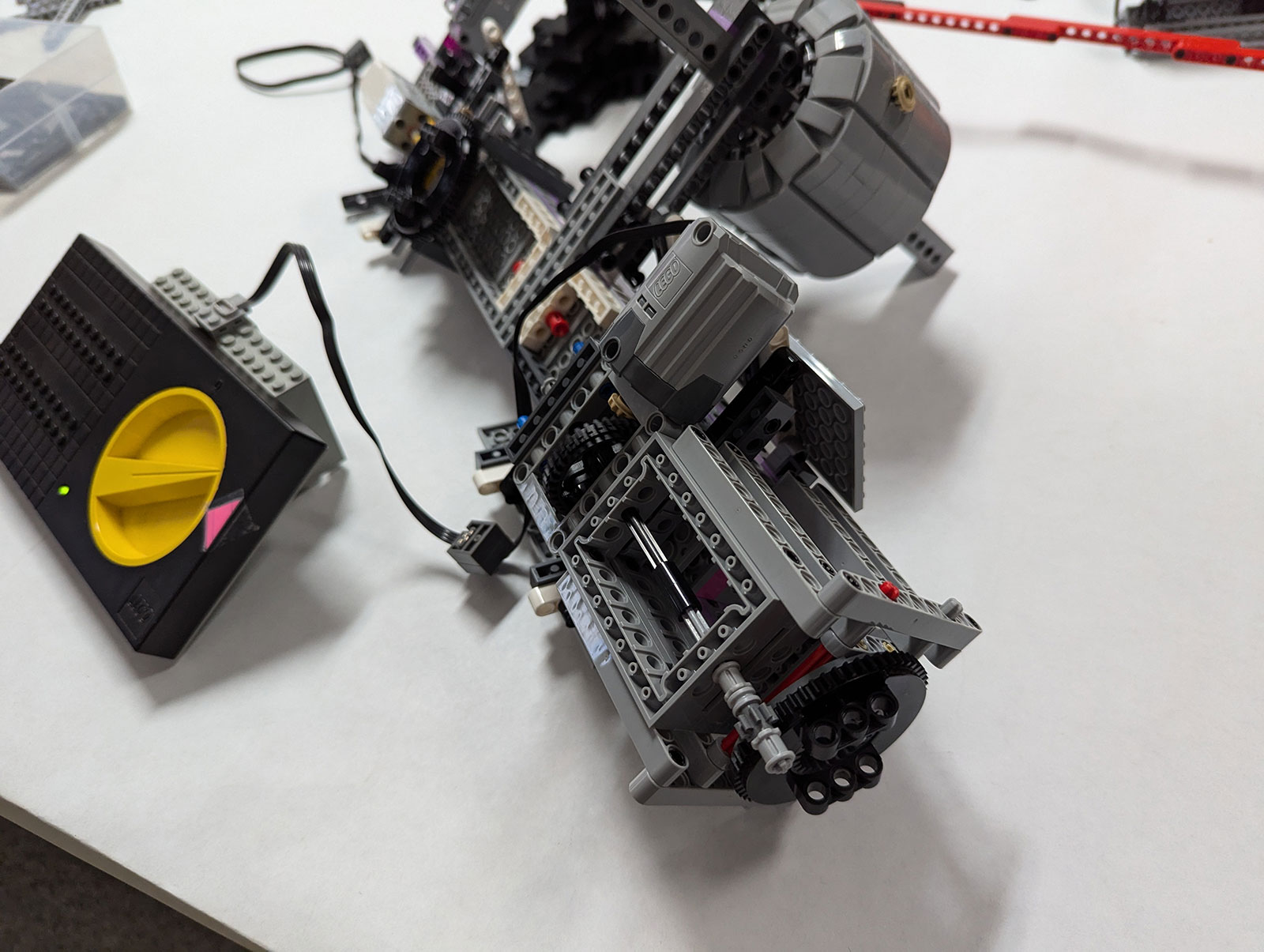 LEGO Technic prototype of a solar-panel drive mechanism laid on a workbench