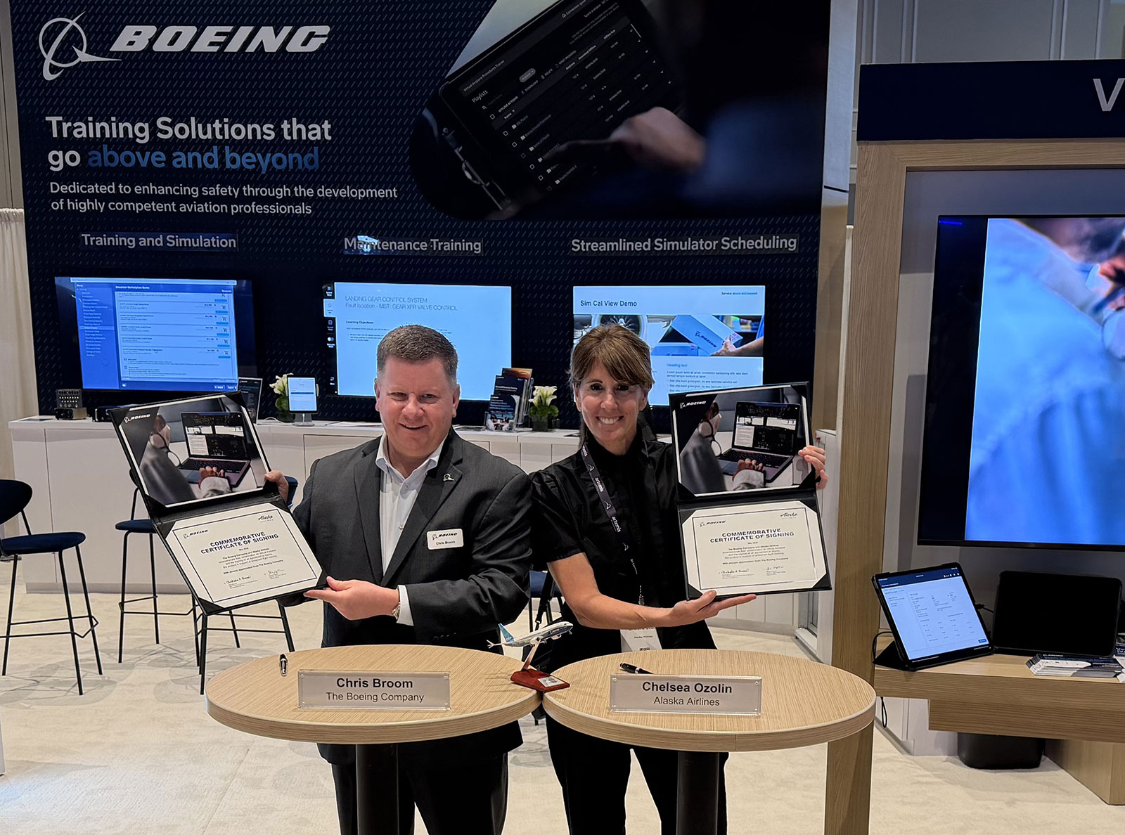 Chris Broom, vice president of Commercial Training Solutions for Boeing, and Chelsea Ozolin, director of Flight Ops training for Alaska Airlines, commemorated the agreement with a ceremonial signing at the World Aviation Training Summit.