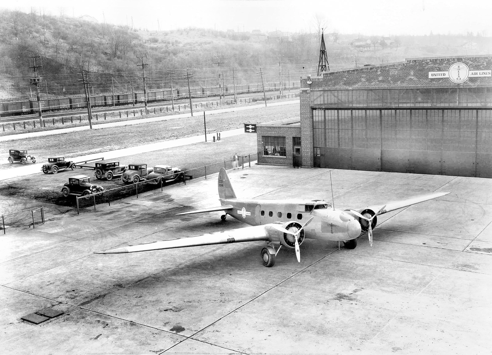 black and white photo of aircraft on tarmac
