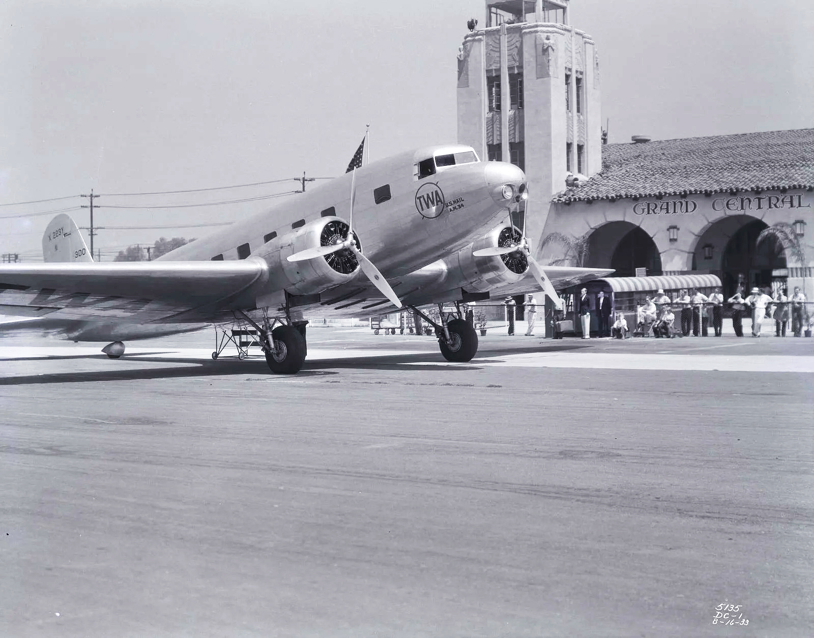black and white photo of aircraft on tarmac