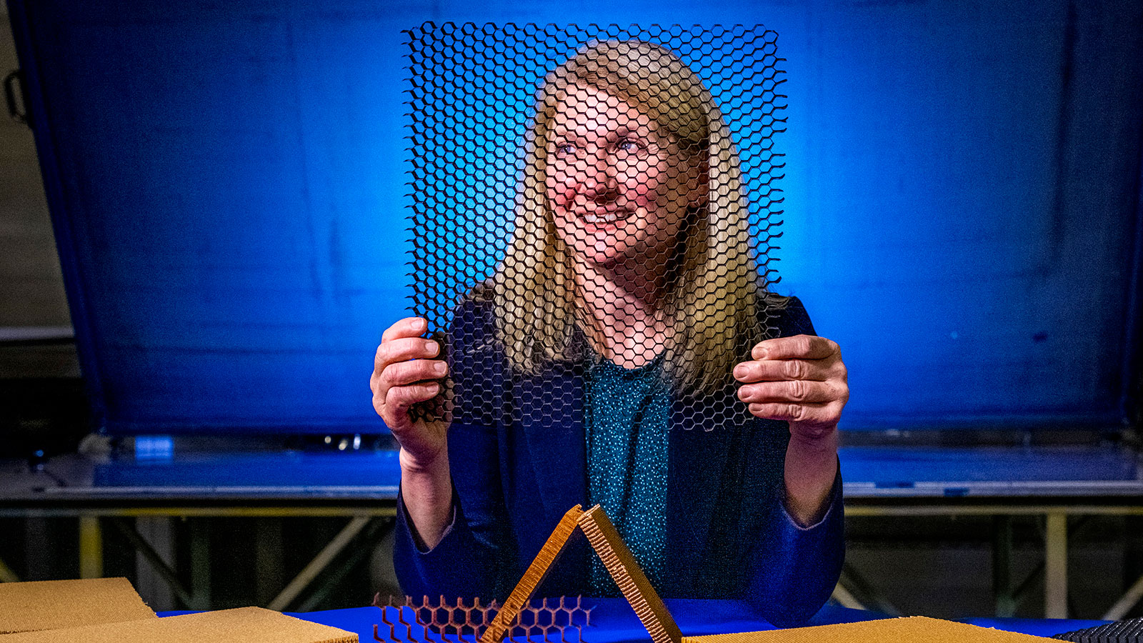 Eileen Kutscha, a Boeing materials and process engineer, with Boeing’s newly qualified honeycomb core.