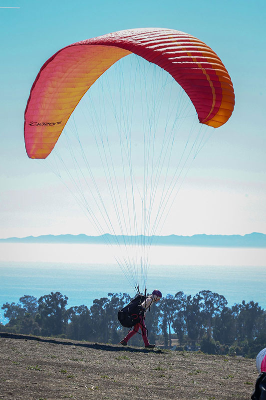 Eileen Kutscha prepares to launch on a paragliding flight.