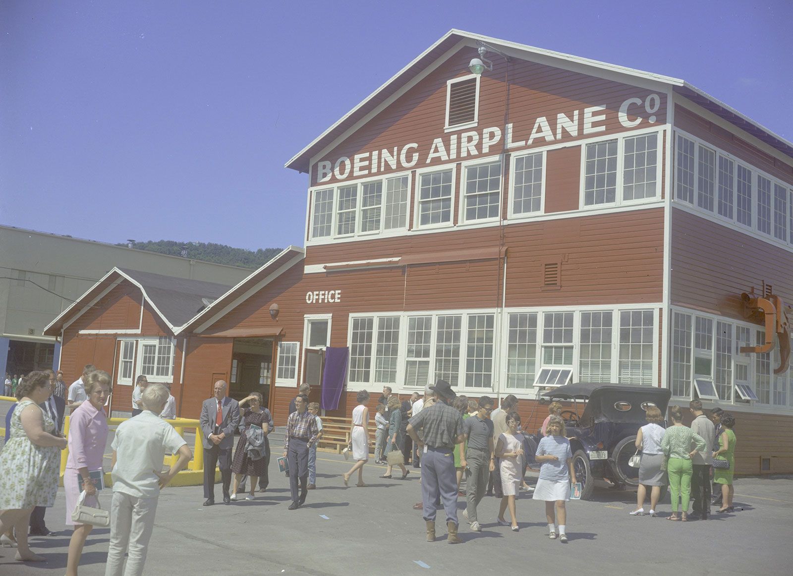 Color photo of people in front of Red Barn