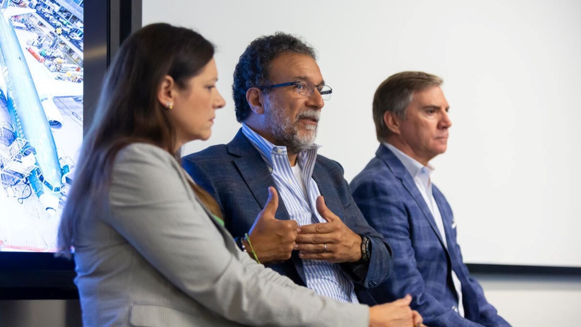 Boeing leaders (from left to right) Kim Pastega, Ihssane Mounir and Mike Fleming speak to journalists ahead of the 2026 Farnborough International Airshow. (Paul Gordon © Boeing)
