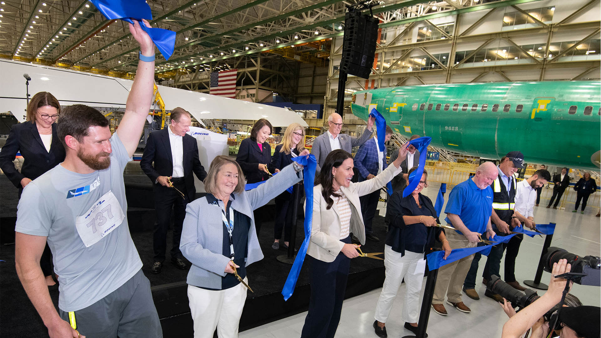Boeing leaders, government officials and teammates cut the ceremonial ribbon to officially open the 737 North Line.