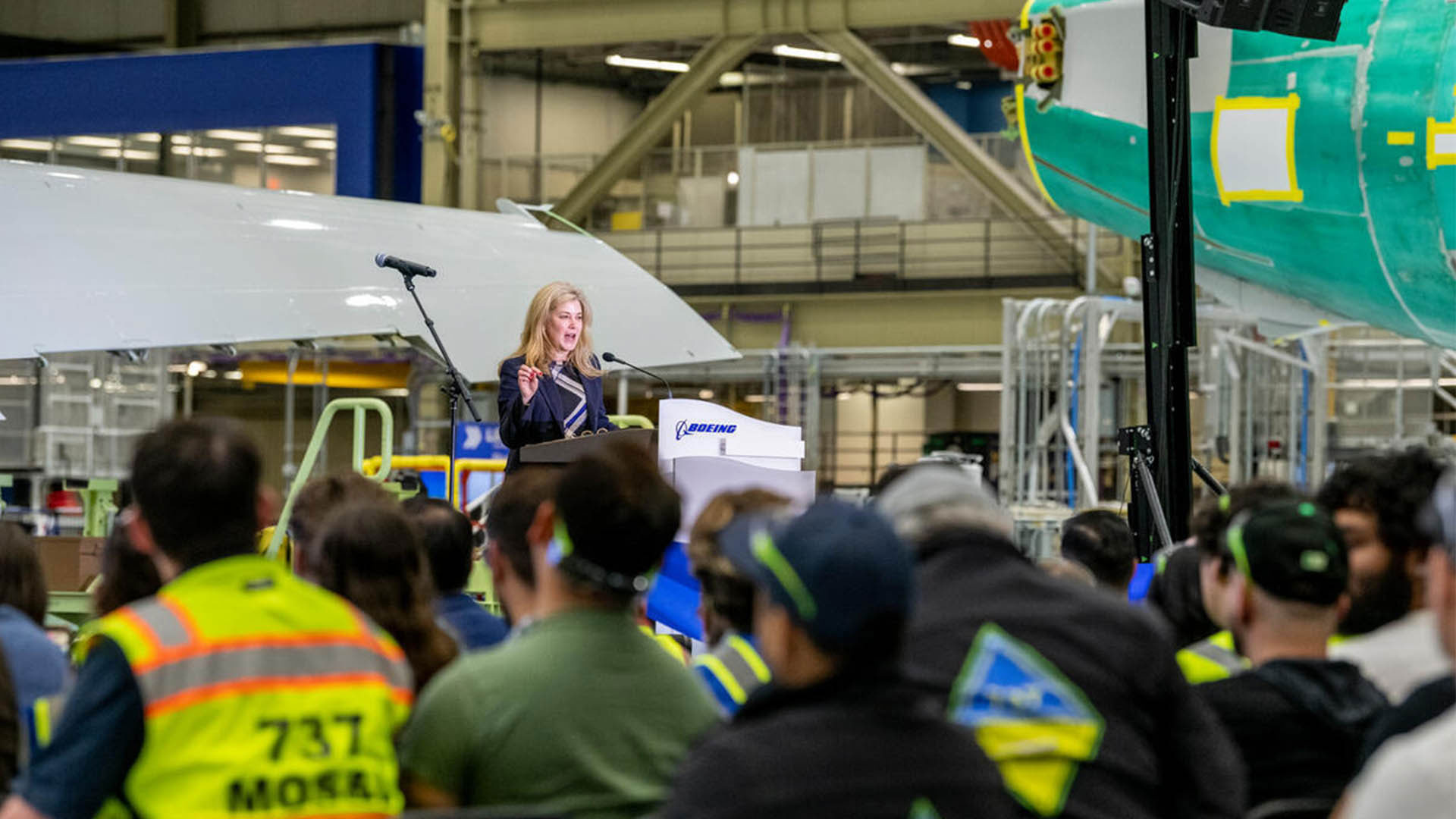 Stephanie Pope, president and CEO of Boeing Commercial Airplanes, speaks to the crowd at the 737 North Line grand opening event.