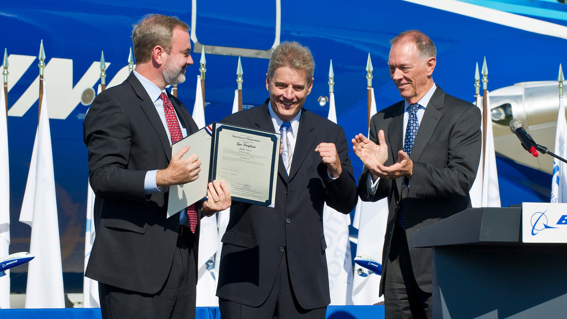 On Aug. 26, 2011, FAA Administrator Randy Babbitt (right) presented the U.S. Type Certificate, which verifies that the 787 has been tested and found to be in compliance with all federal regulations, to 787 Chief Pilot Mike Carriker and 787 Vice President and Chief Project Engineer Mike Sinnett.