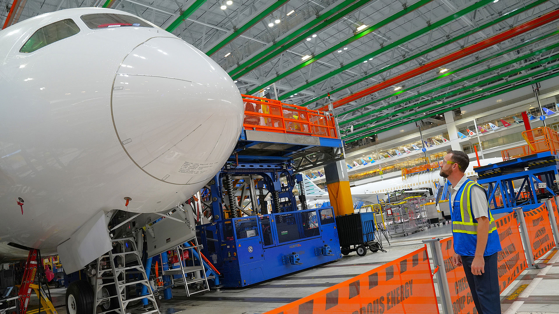 Tyler Savell looks at the nose of a 787 in the Final Assembly building.