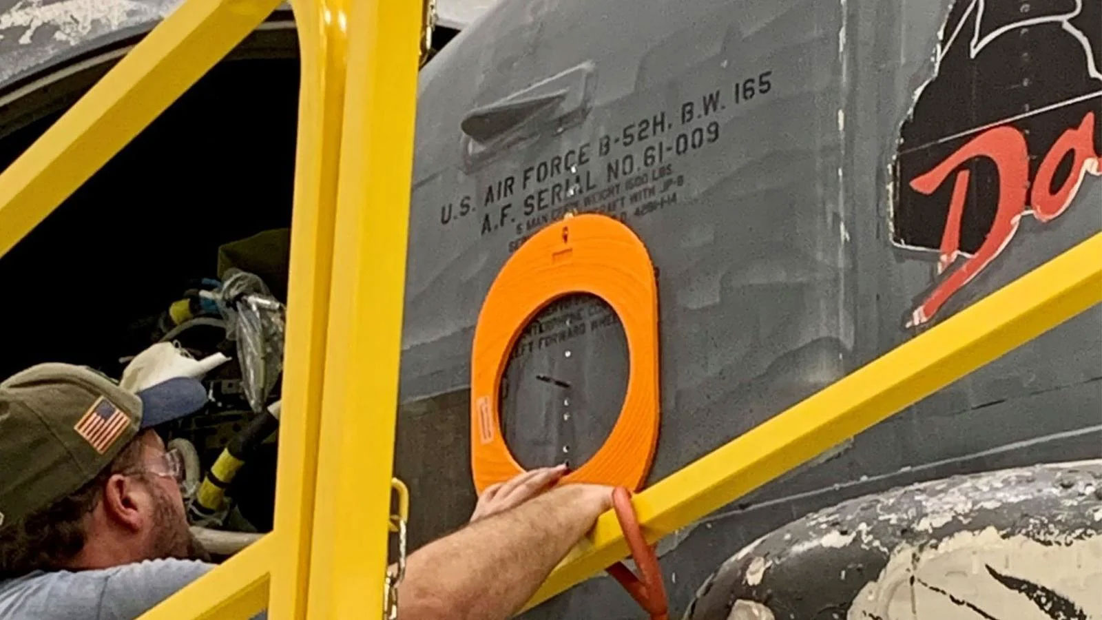 A Boeing engineer measures the skin panels on the aircraft using a 3D-printed part designed to help mitigate risk when implementing airspeed probes.