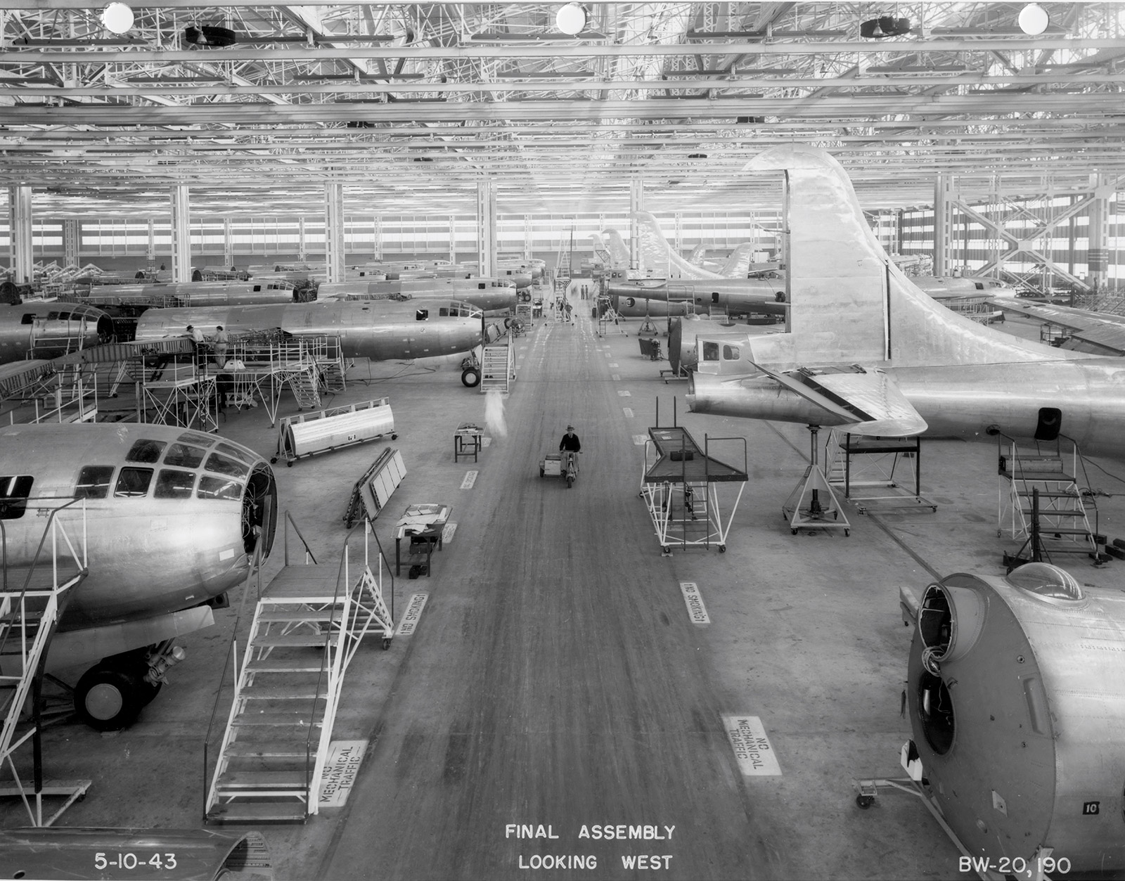Black and white image of B-29 bombers being built inside a manufacturing facility.