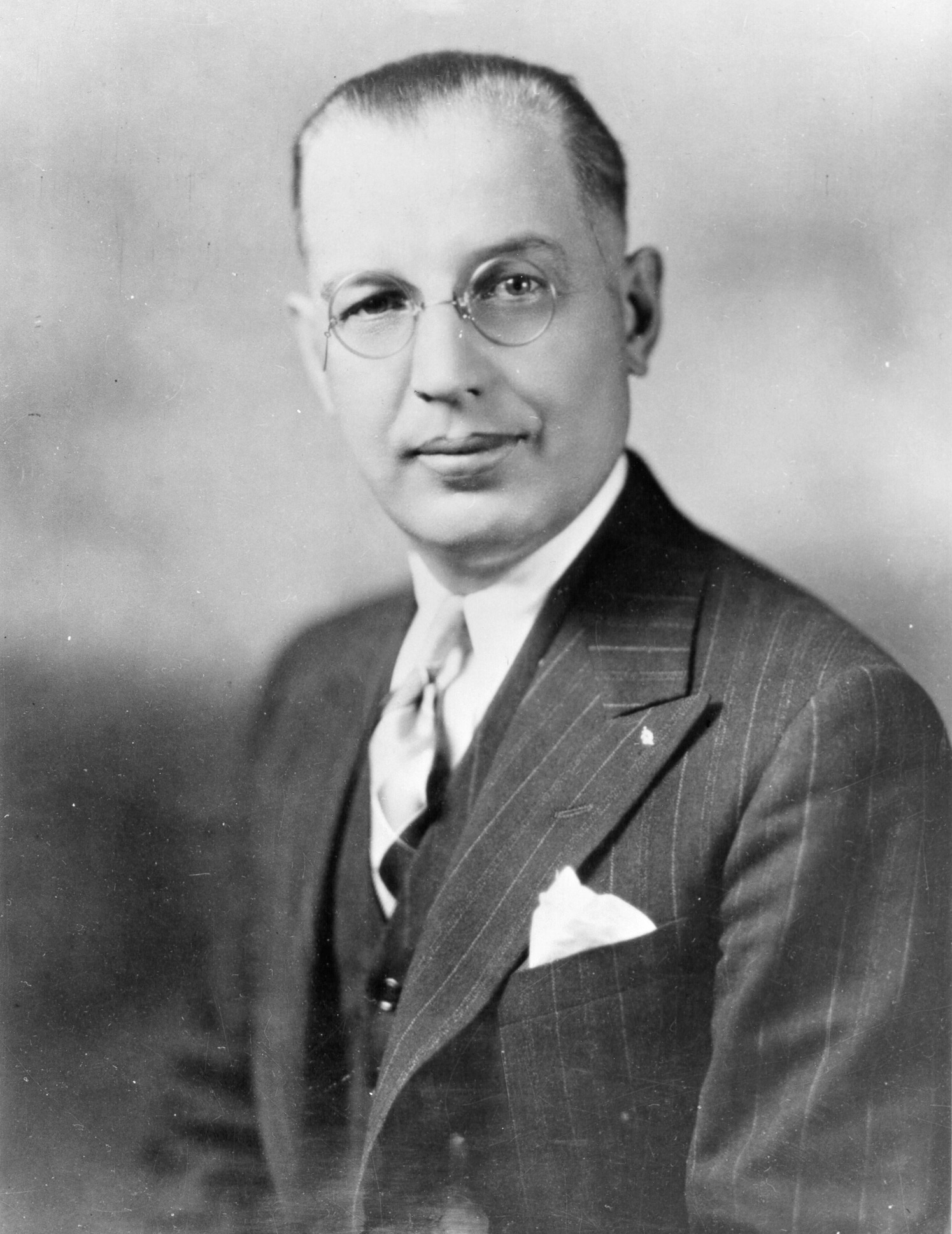 A black and white portrait of a man