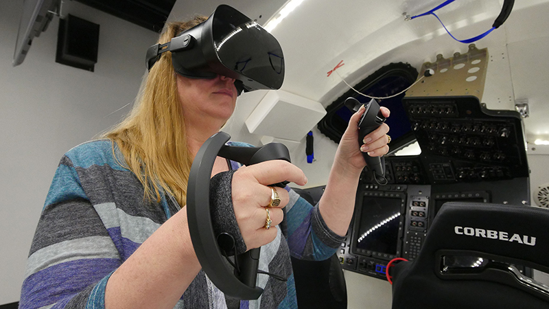Woman using vr headset and gloves