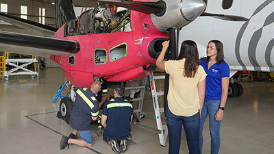 Team working on an airplane.