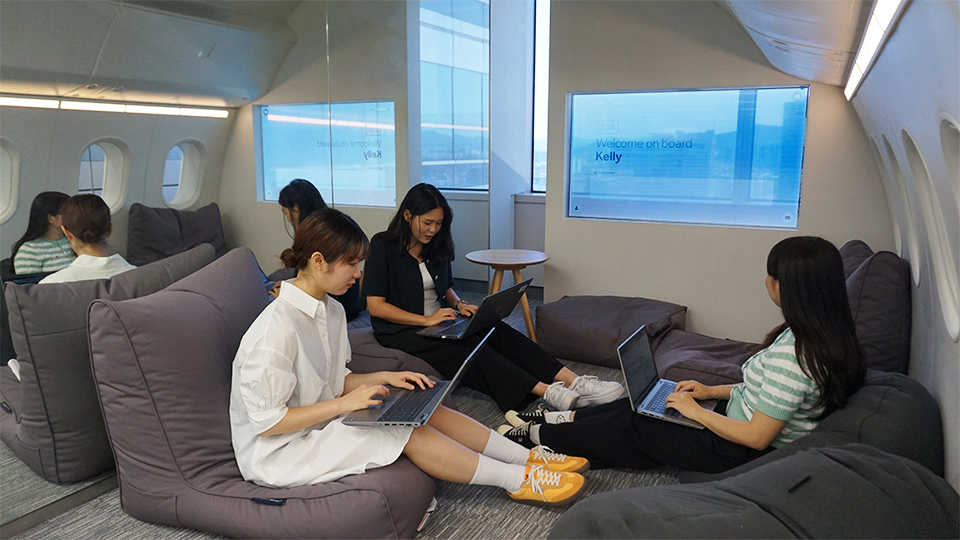 three engineers sit in demo area