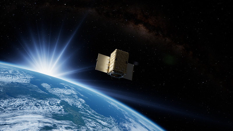 A satellite orbiting Earth with the sun rising in the background, showcasing its advanced technology and design.