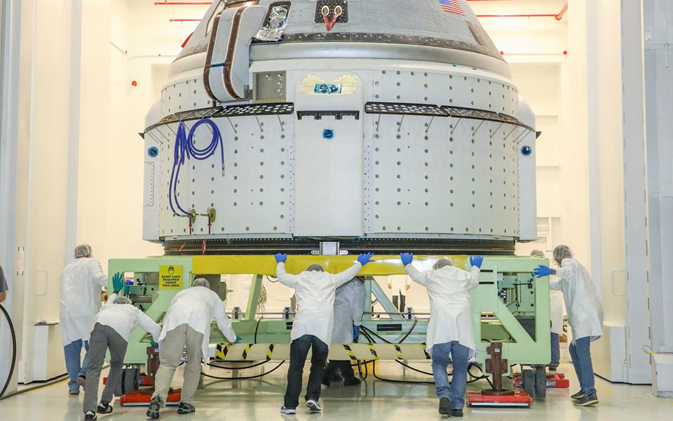 The CST-100 Starliner spacecraft to be flown on Boeing’s Orbital Flight Test (OFT) is viewed Nov. 2, 2019, while undergoing launch preparations inside the Commercial Crew and Cargo Processing Facility at Kennedy Space Center in Florida. During the OFT mission, the uncrewed Starliner spacecraft will fly to the International Space Station for NASA’s Commercial Crew Program.
