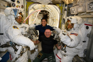 (June 24, 2024) NASA’s Boeing Crew Flight Test astronauts Suni Williams and Butch Wilmore (at center) pose with Expedition 71 Flight Engineers (far left) Mike Barratt and Tracy C. Dyson (far right), both NASA astronauts, in their spacesuits aboard the International Space Station’s Quest airlock.