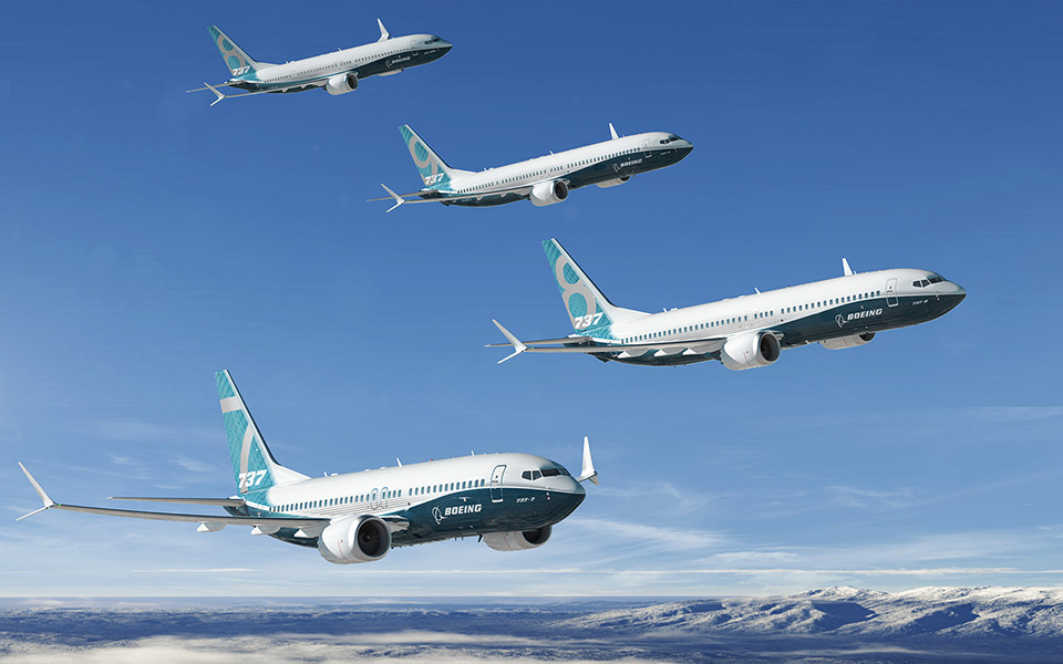 Rendering of 4 airplanes in flight that make up the 7 3 7 MAX family.