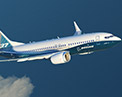 Image of the 7 3 7 MAX 7 in flight, wing and engine view.