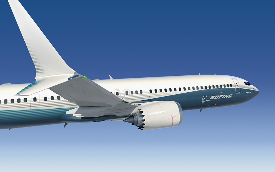 Image of the 7 3 7 MAX, wing tip and engine view in flight.