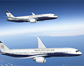 Picture of two Boeing Business Jets in flight.