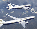 Picture of two Boeing Business Jets in flight.
