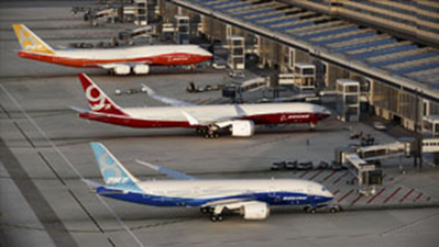 Arial picture of Boeing airplanes at boarding gate.