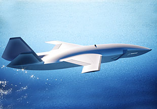 Side view of MQ-28 in flight over water.