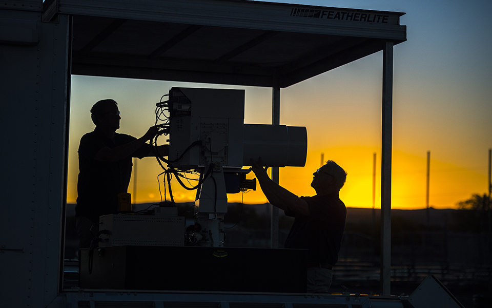 Boeing employees configure a High Energy Laser