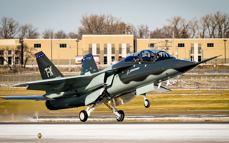 Picture of Boeing T-7A Red Hawk aircraft during take off.