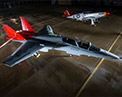 Boeing T-7A Red Hawk and P-51 Tuskegee aircraft on Flight Ramp.