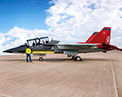 Picture of the T7A Red Hawk on flight ramp with personnel.