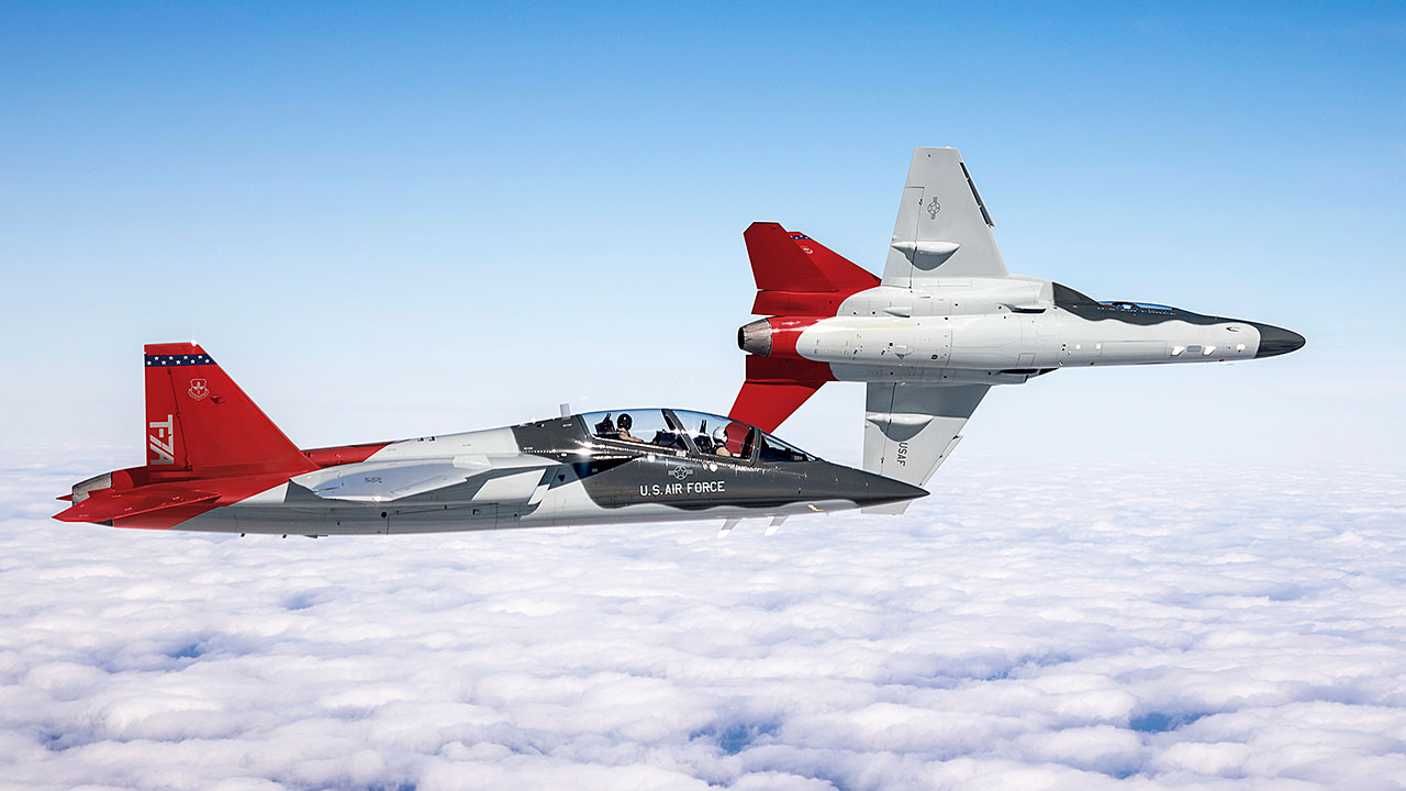 Picture of two T-7A Red Hawks in flight.