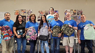 Boeing employees in Mesa, Arizona, packed and distributed backpacks filled with school supplies to six local schools.
