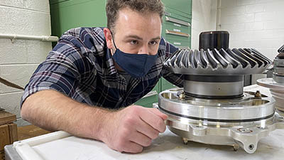 Boeing engineer inspects Chinook part