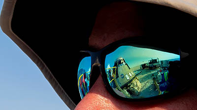Boeing firefighter glasses reflection Starliner OTF-2 landing