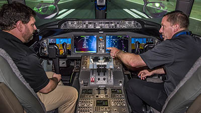 Boeing engineers in 777-9 flight deck simulator