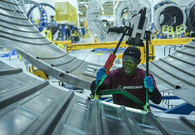 A worker inspecting material.