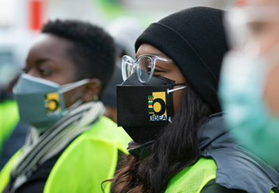 Individuals wearing protective face masks.